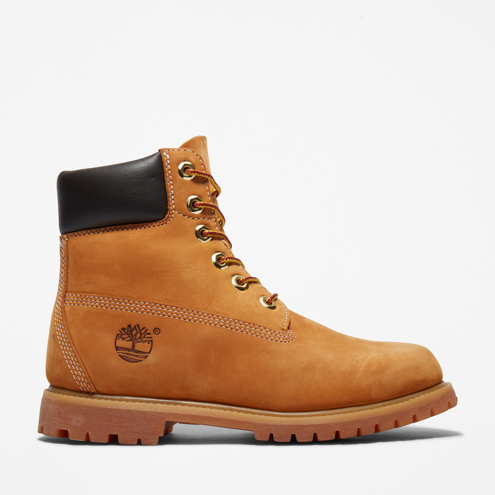 Wheat Timberland® 6-Inch Boot for Women. Waterproof leather, padded collar, lace-up closure. Durable outsole for all terrains. Classic style for everyday adventures.