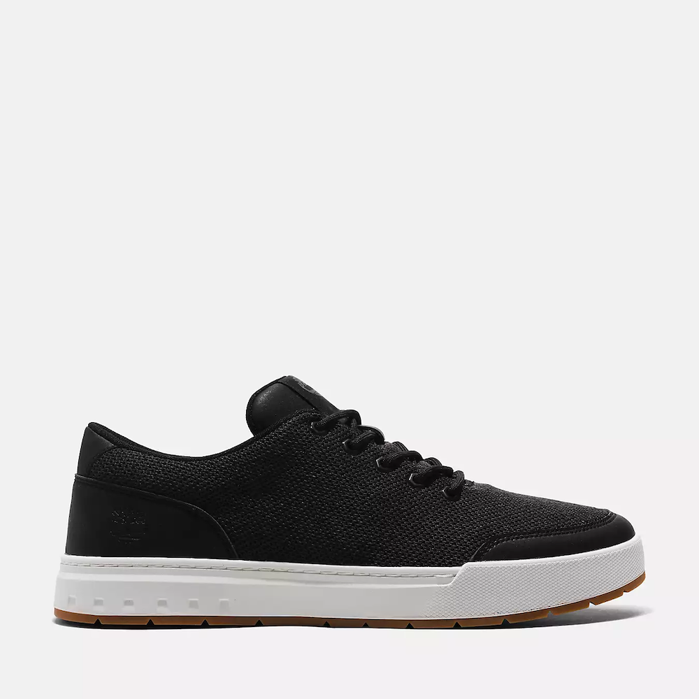 Black Timberland® Maple Grove Low Lace-Up Sneaker for Men. Recycled PET upper, lining for comfort. Lace-up fit, flexible midsole. Sleek black upper, durable outsole.