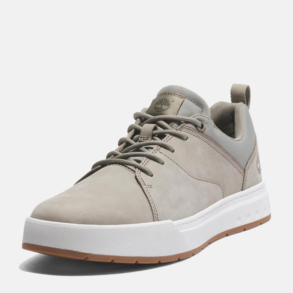 Timberland® Maple Grove Low Lace Up Sneaker for Men. Light taupe colored full grain leather sneaker with lace-up closure, comfortable lining made with recycled materials, and rubber outsole for traction. Perfect for everyday wear.