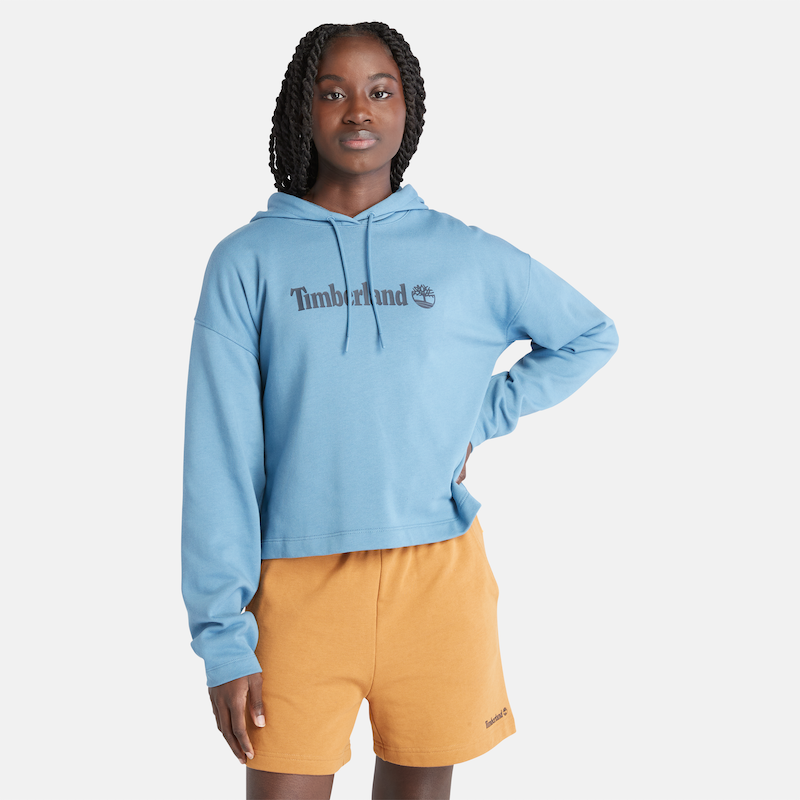 TIMBERLAND LINEAR LOGO RELAXED FIR CROPPED HOODIE FOR WOMEN IN MEDIUM BLUE