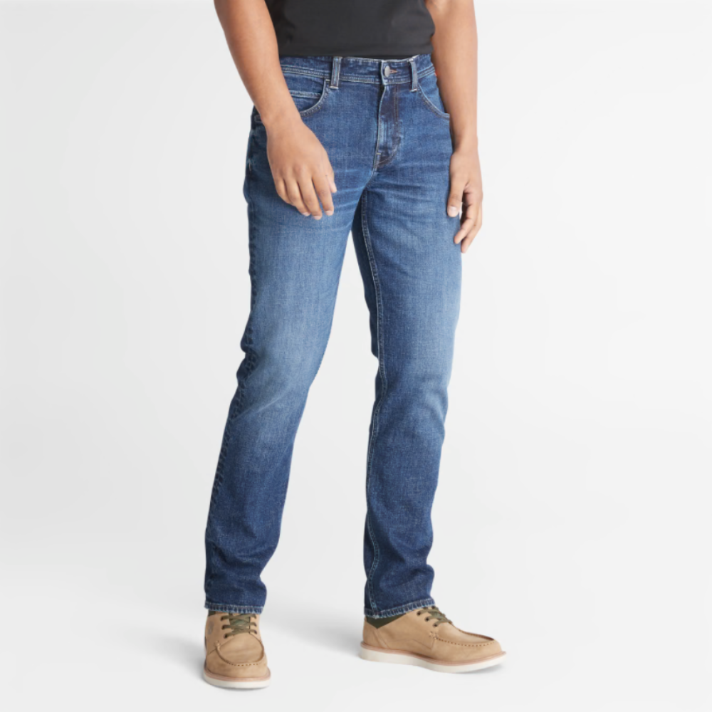 Timberland® Indigo Stretch Denim for Men in Indigo. Made with organic cotton for sustainability and comfort. Slim-fit cut for modern style. Classic 5-pocket design for functionality. Indigo wash for timeless look.