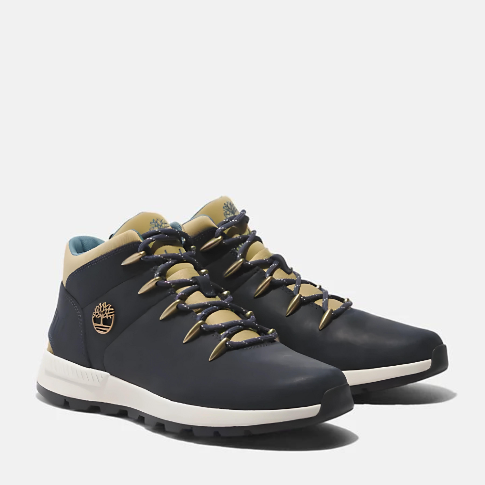 TimberlandÃ‚Â® Sprint Trekker Mid Sneaker for Men. Dark blue full grain leather sneaker with lace-up closure for a secure fit, lightweight construction for comfort, supportive mid-ankle design, and lugged outsole for traction. Pairs well with casual outfits.