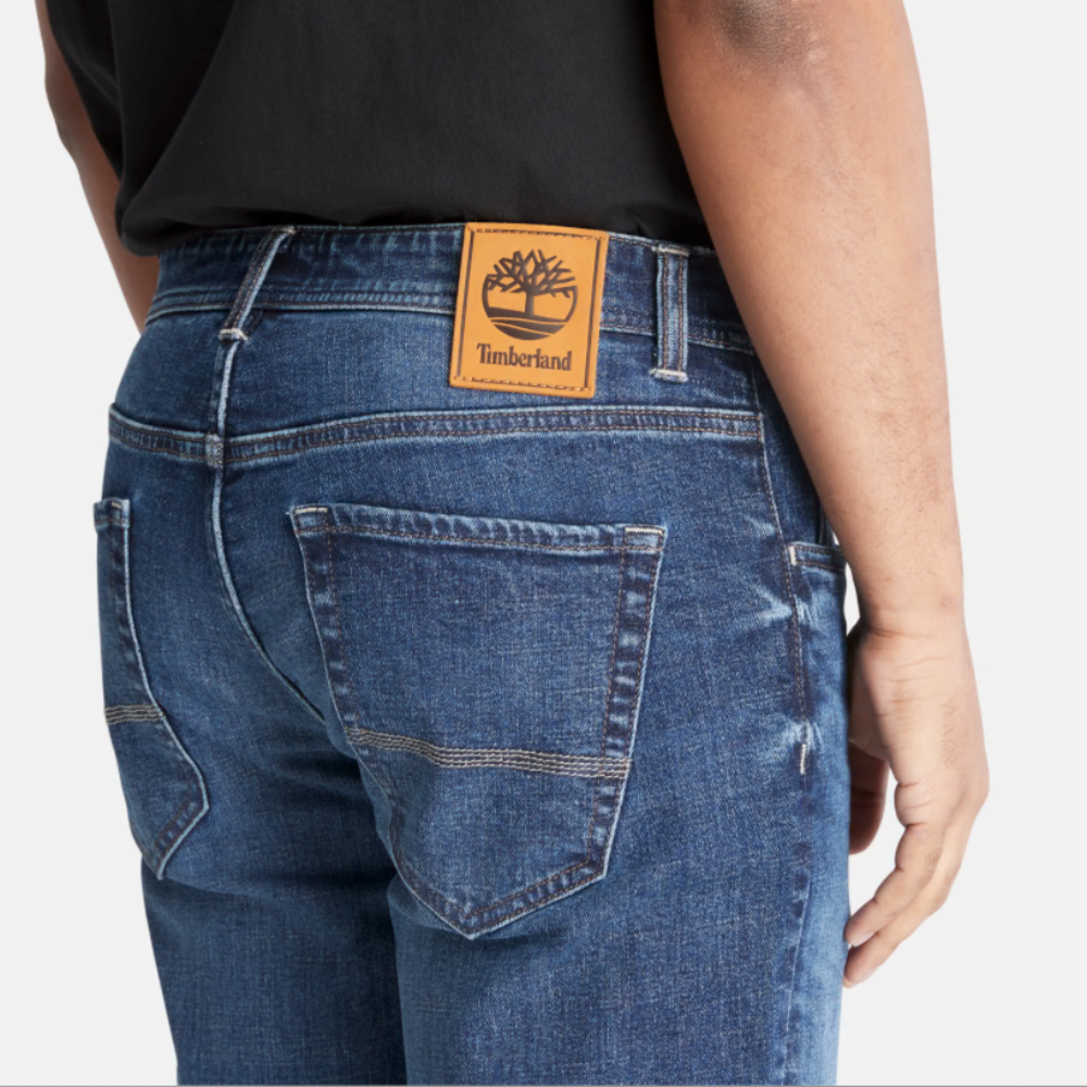 Timberland Indigo Stretch Denim for Men in Indigo. Made with organic cotton for sustainability and comfort. Slim-fit cut for modern style. Classic 5-pocket design for functionality. Indigo wash for timeless look.