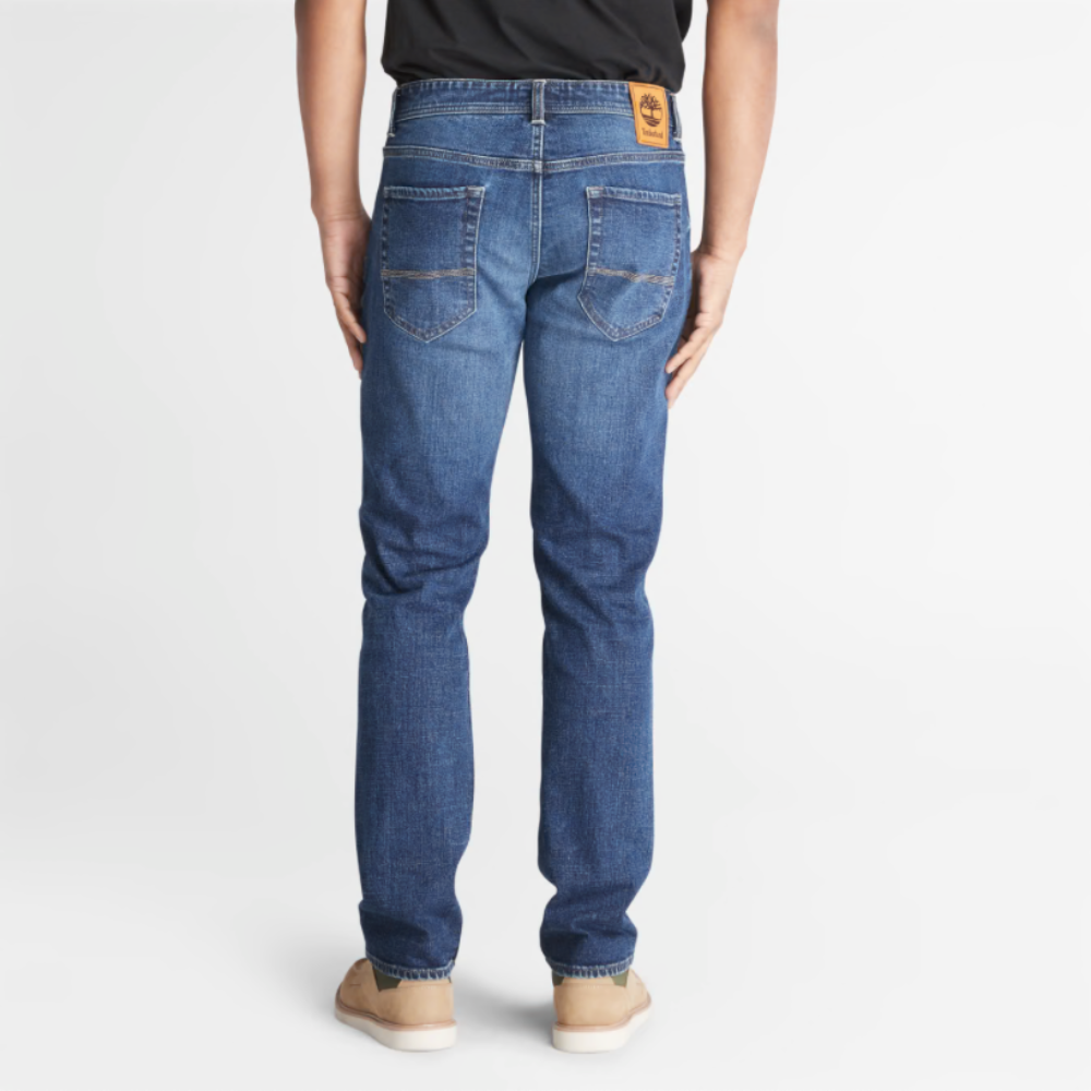 Timberland Indigo Stretch Denim for Men in Indigo. Made with organic cotton for sustainability and comfort. Slim-fit cut for modern style. Classic 5-pocket design for functionality. Indigo wash for timeless look.