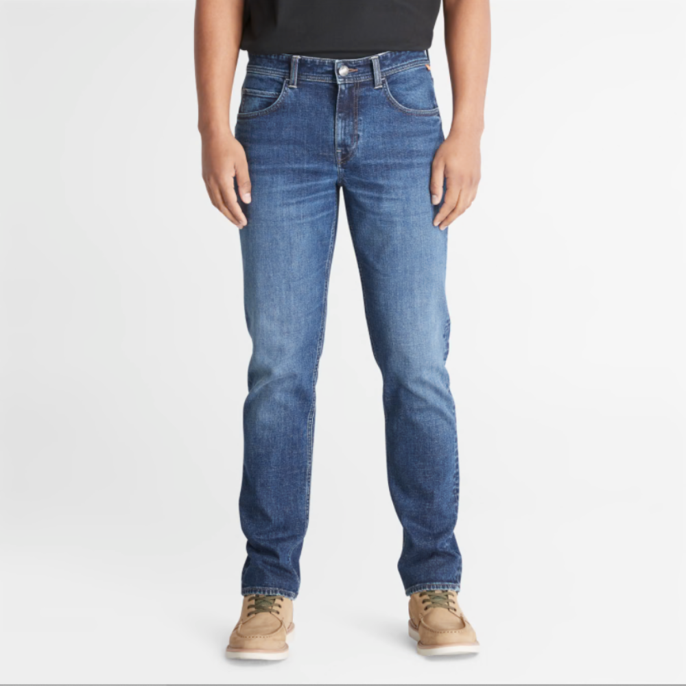 Timberland® Indigo Stretch Denim for Men in Indigo. Made with organic cotton for sustainability and comfort. Slim-fit cut for modern style. Classic 5-pocket design for functionality. Indigo wash for timeless look.