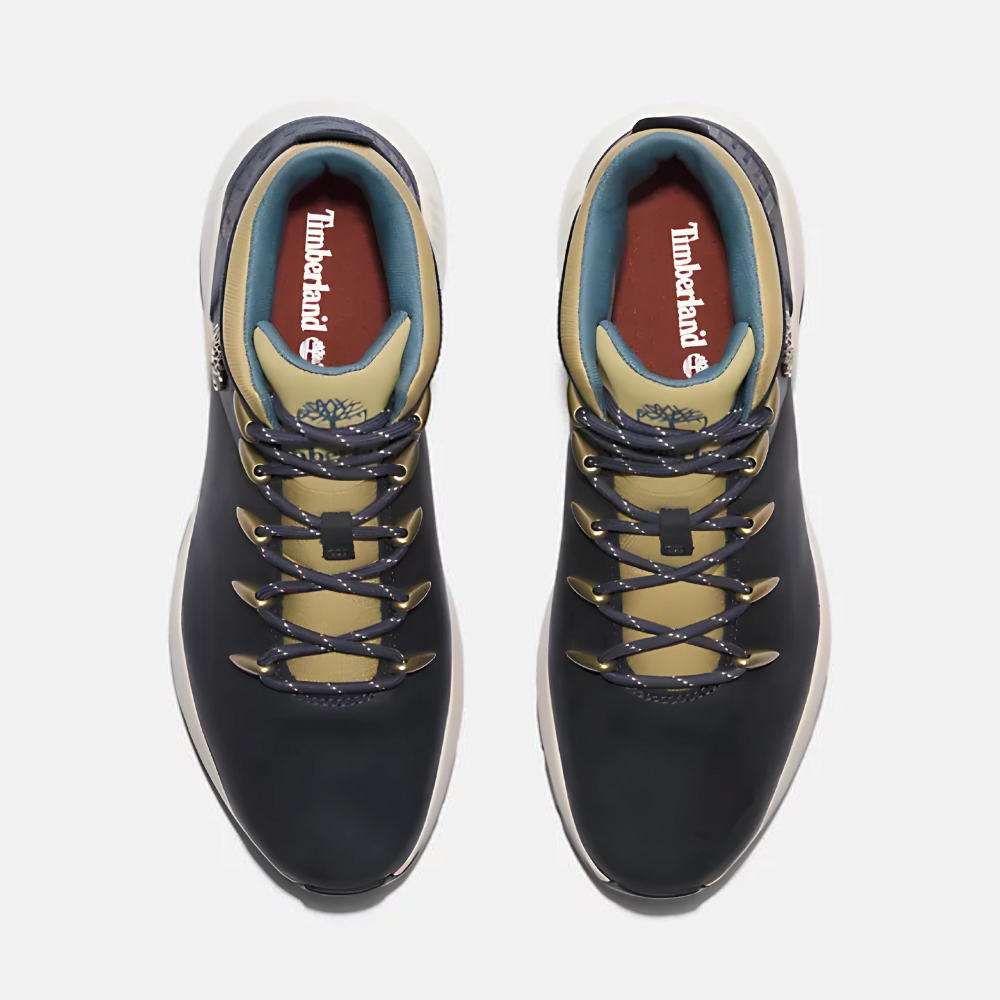 TimberlandÃ‚Â® Sprint Trekker Mid Sneaker for Men. Dark blue full grain leather sneaker with lace-up closure for a secure fit, lightweight construction for comfort, supportive mid-ankle design, and lugged outsole for traction. Pairs well with casual outfits.