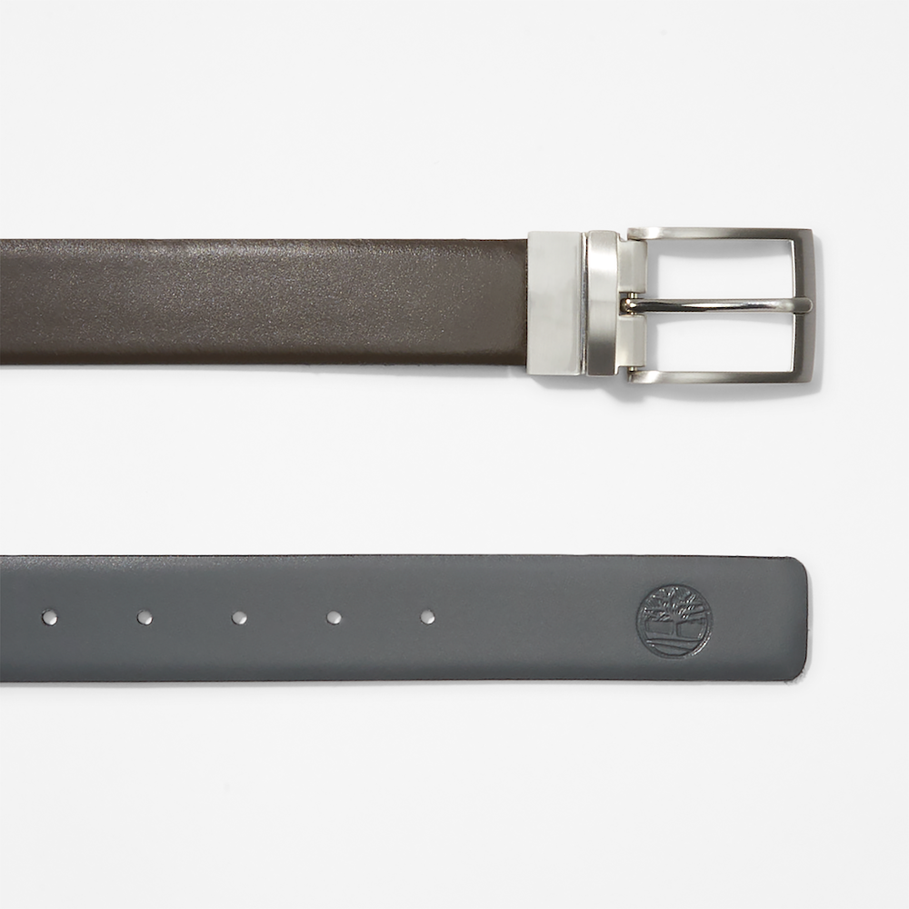 Dark brown TimberlandÂ® Reversible Leather Belt. Reversible belt with dark brown and black color options. Made from 100% split cow leather for quality and affordability. Features antiqued silver hardware and a reversible buckle system.  Embossed logo on the tip