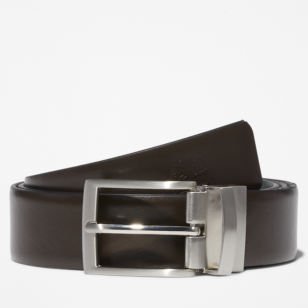 Dark brown Timberland® Reversible Leather Belt. Reversible belt with dark brown and black color options. Made from 100% split cow leather for quality and affordability. Features antiqued silver hardware and a reversible buckle system.  Embossed logo on the tip