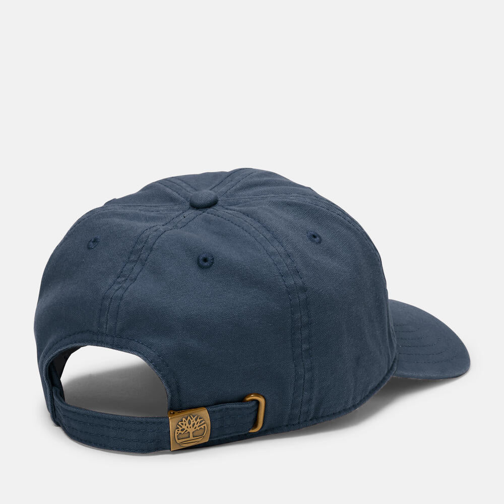 Timberland® Soundview Cotton Canvas Baseball Cap in Navy. Navy cotton canvas baseball cap with embroidered eyelets and adjustable strap. Lightweight and comfortable for casual wear, sun protection, or activewear. Classic and versatile for any occasion.
