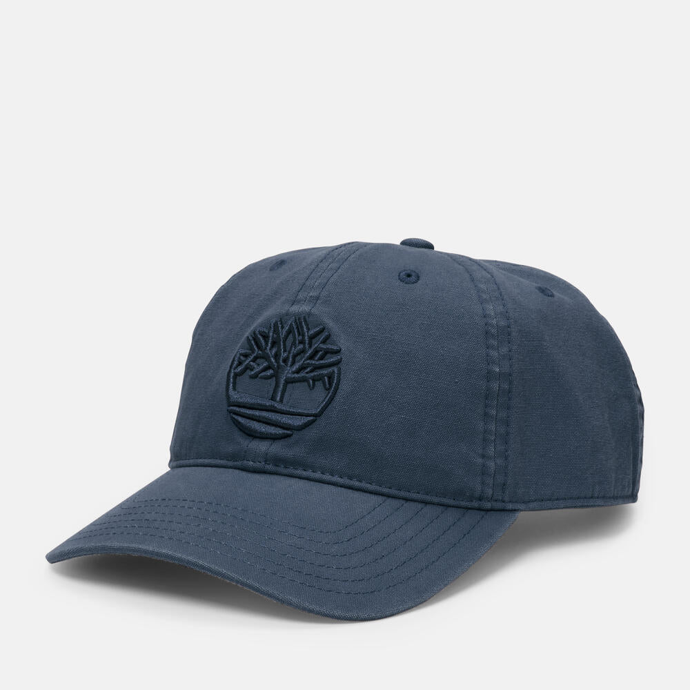 Timberland® Soundview Cotton Canvas Baseball Cap in Navy. Navy cotton canvas baseball cap with embroidered eyelets and adjustable strap. Lightweight and comfortable for casual wear, sun protection, or activewear. Classic and versatile for any occasion.