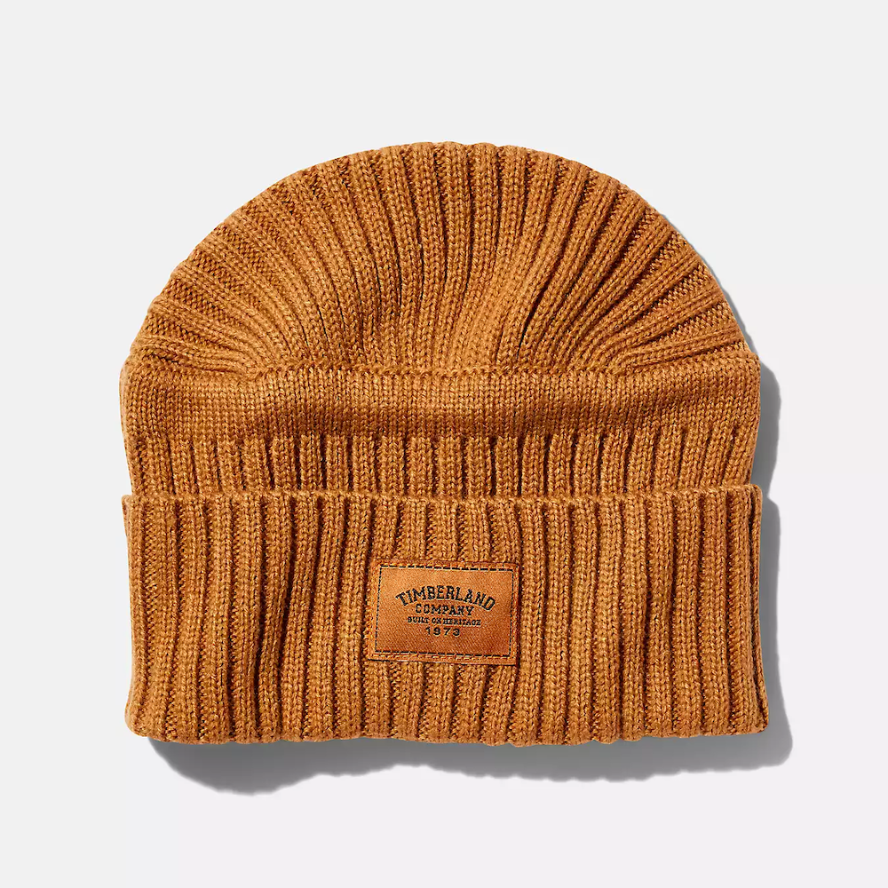 Timberland® Ribbed Beanie. Soft acrylic for comfort. Ribbed knit pattern for style. Woven Timberland® logo patch. Fold-up cuff for adjustable fit. Single layer for breathability. One size fits most.