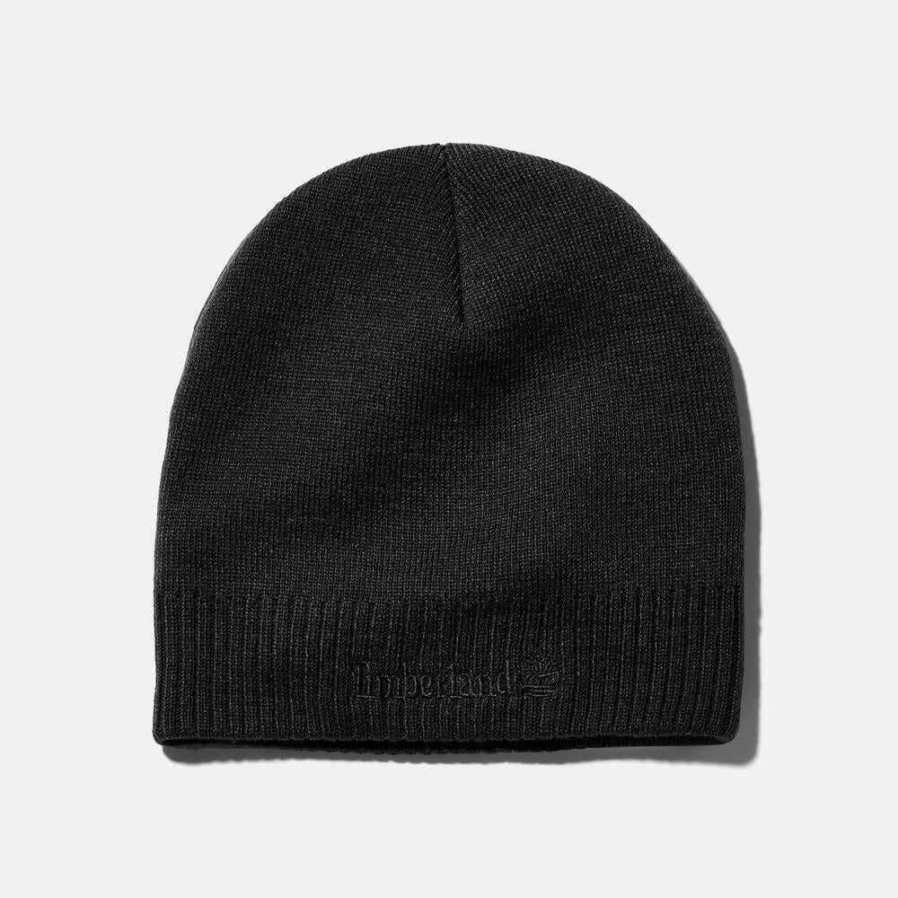 Timberland® Knit Logo Beanie in Black. Black knit beanie with a Timberland® logo. Comfortable and warm for winter wear.