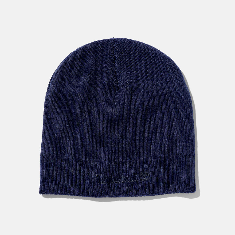 Timberland Knit Logo Beanie in Navy. Navy knit beanie with a Timberland logo. Comfortable and warm for winter wear.