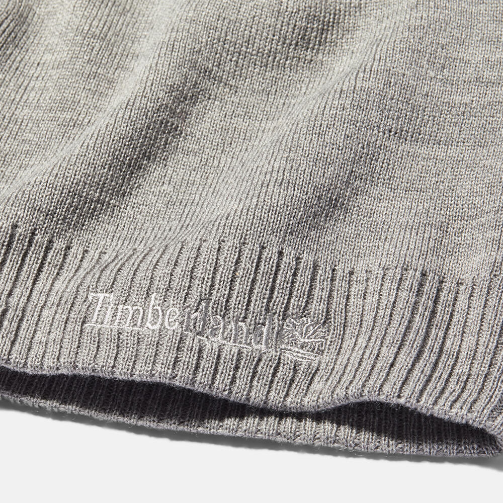 Timberland® Knit Logo Beanie in Grey. Grey knit beanie with a Timberland® logo. Comfortable and warm for winter wear.