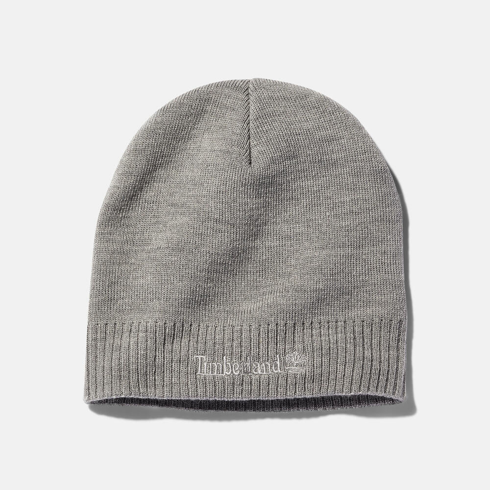 Timberland® Knit Logo Beanie in Grey. Grey knit beanie with a Timberland® logo. Comfortable and warm for winter wear.