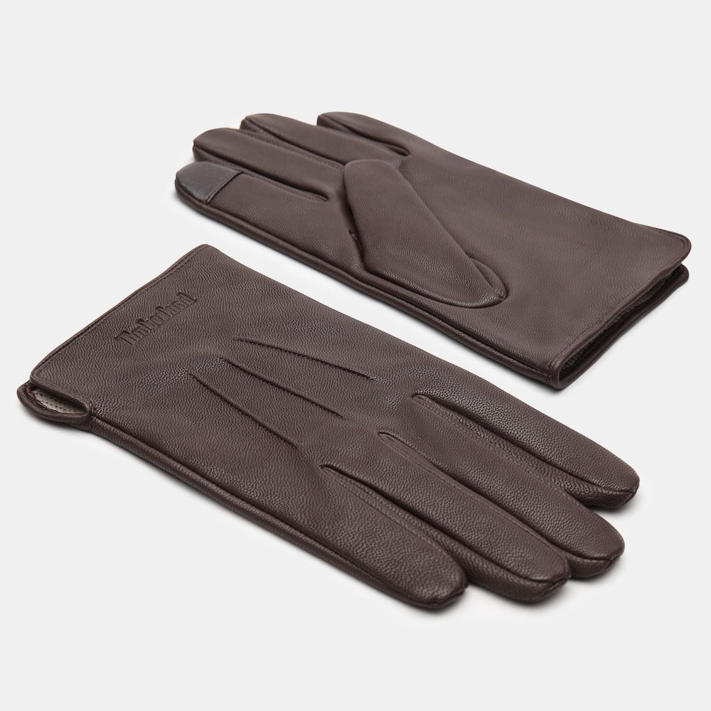 Timberland® Smart Casual Leather Gloves for Men. Brown leather gloves featuring touchscreen technology for convenience, soft lining for comfort, and a classic design that complements various outfits. Perfect for everyday wear in cooler weather.