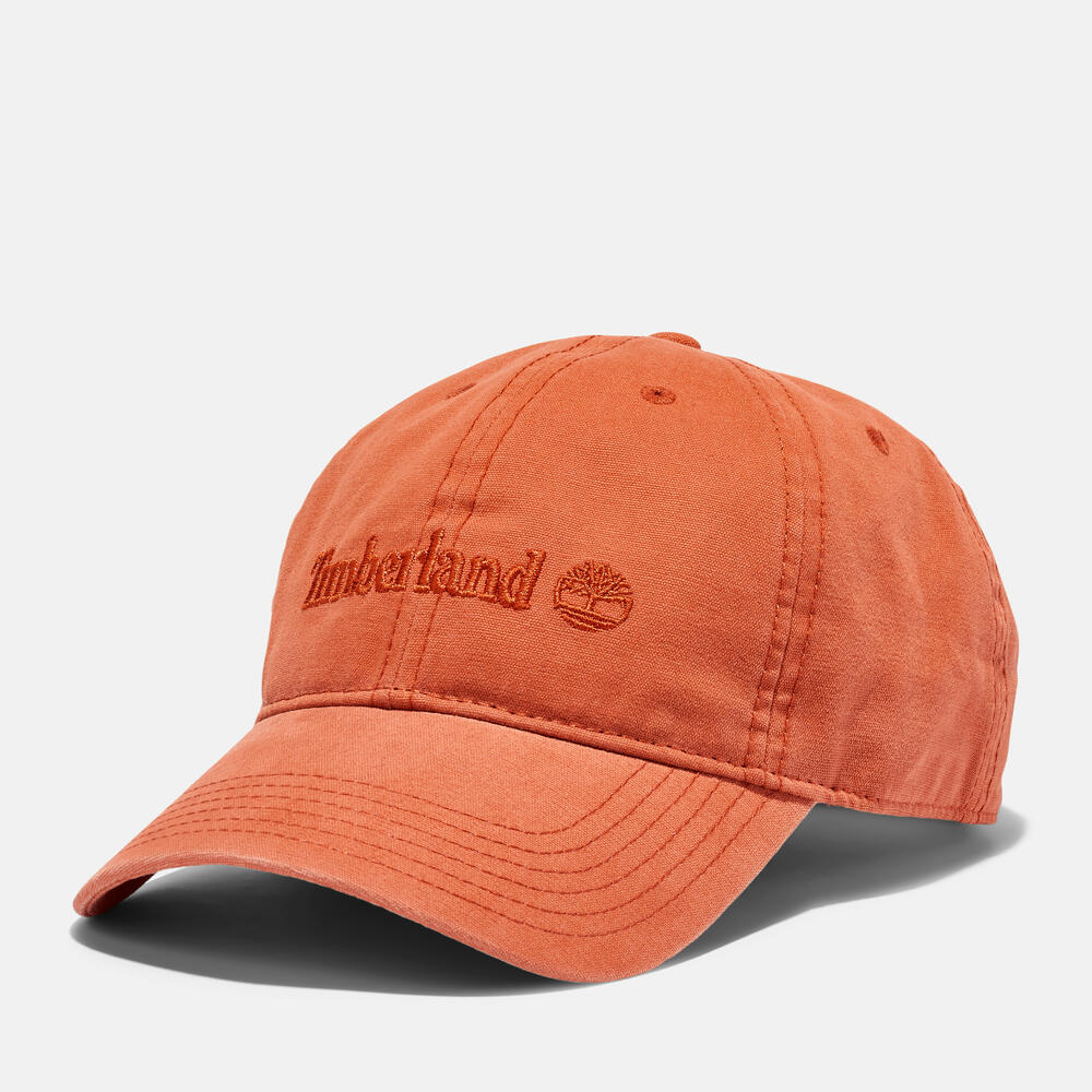 Timberland® Cooper Hill Canvas Baseball Cap in Burnt Sienna. Burnt sienna cotton canvas baseball cap with adjustable strap. Classic design for casual wear and sun protection.