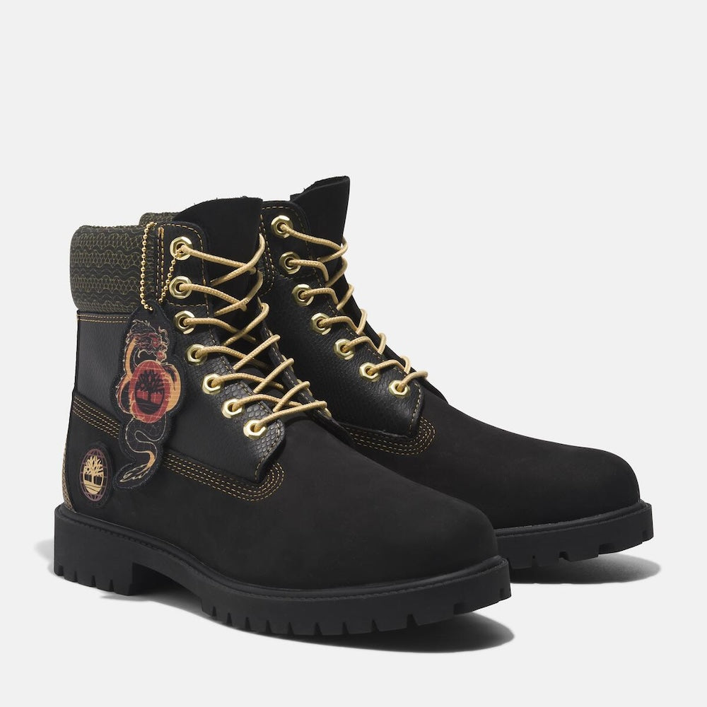 Black Timberland® Heritage 6-Inch Boot for Men. Classic black boot featuring a combination of premium leather and suede for a stylish and durable look. Seam-sealed construction for waterproof protection. Padded collar for comfort, lace-up closure for secure fit.