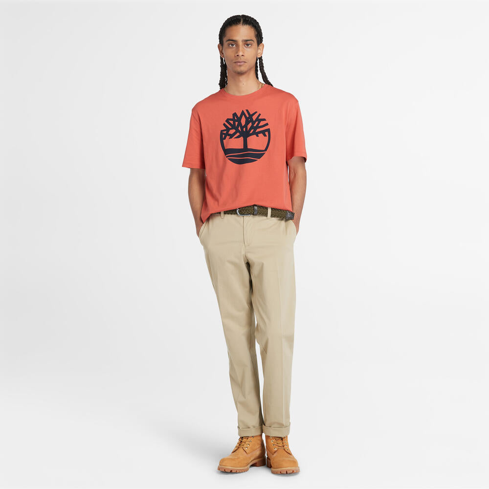 Timberland‚¡® Kennebec River Linear T-Shirt for Men in Coral. Coral t-shirt for men with a bold linear Timberland‚¡® logo. Made from eco-conscious cotton for a sustainable choice. Relaxed fit for comfort. Versatile for casual wear or layering.