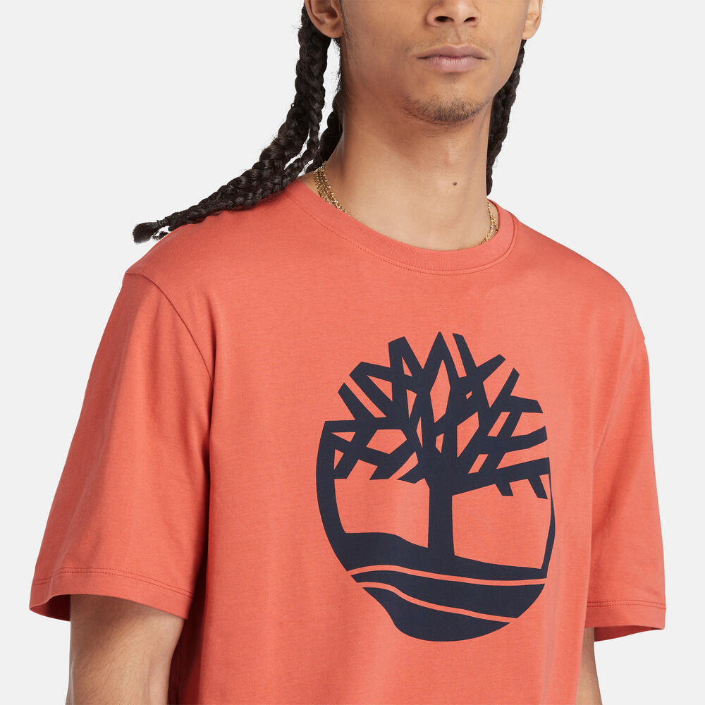 Timberland‚¡® Kennebec River Linear T-Shirt for Men in Coral. Coral t-shirt for men with a bold linear Timberland‚¡® logo. Made from eco-conscious cotton for a sustainable choice. Relaxed fit for comfort. Versatile for casual wear or layering.