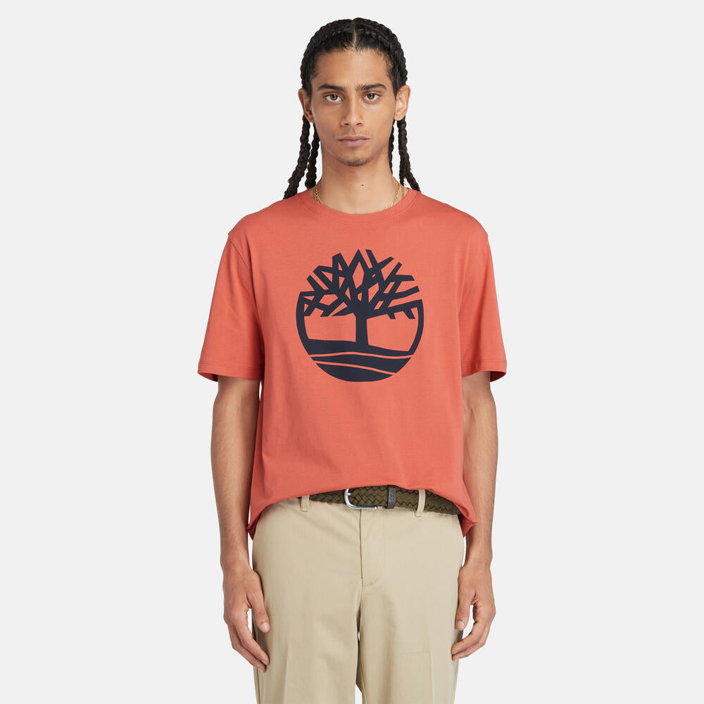 Timberland‚¡® Kennebec River Linear T-Shirt for Men in Coral. Coral t-shirt for men with a bold linear Timberland‚¡® logo. Made from eco-conscious cotton for a sustainable choice. Relaxed fit for comfort. Versatile for casual wear or layering.