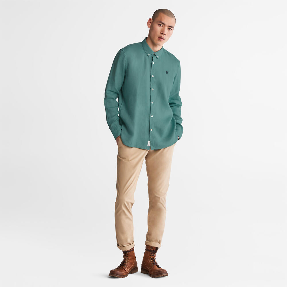 Timberland Mill Brook Linen Shirt for Men in Teal. Teal linen shirt for men with a button-down collar and relaxed fit. Perfect for warm weather and casual occasions.