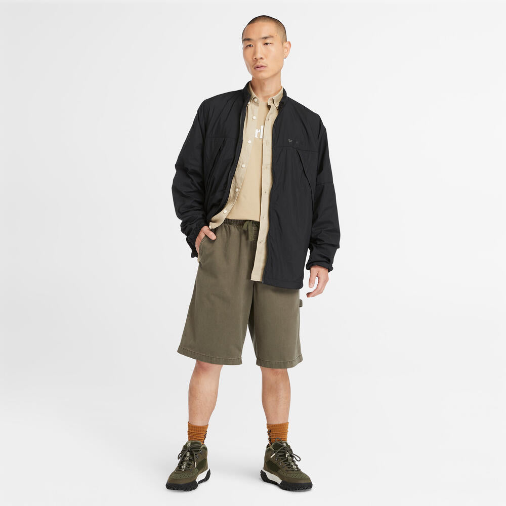  Timberland Mill Brook Linen Shirt for Men in Beige. Beige linen shirt with button-down collar and relaxed fit. Ideal for warm weather and versatile styling.