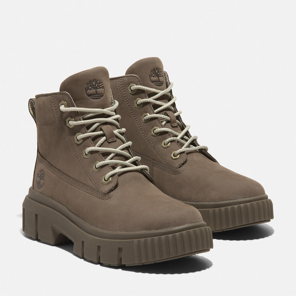 Timberland Greyfield Mid Lace-Up Boot for Women.  Leather boot with lace-up closure, ReBOTL lining, and comfortable cushioning. Versatile for casual wear and urban exploring