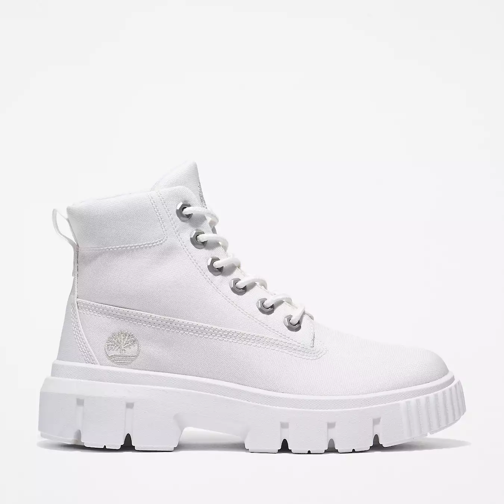 White Timberland® Greyfield Mid Lace-Up Boot for Women. Canvas upper for breathability and fresh look. Bright white color for crisp style. Lace-up closure for secure fit. Comfortable footbed for support and cushioning. Durable rubber outsole for traction.
