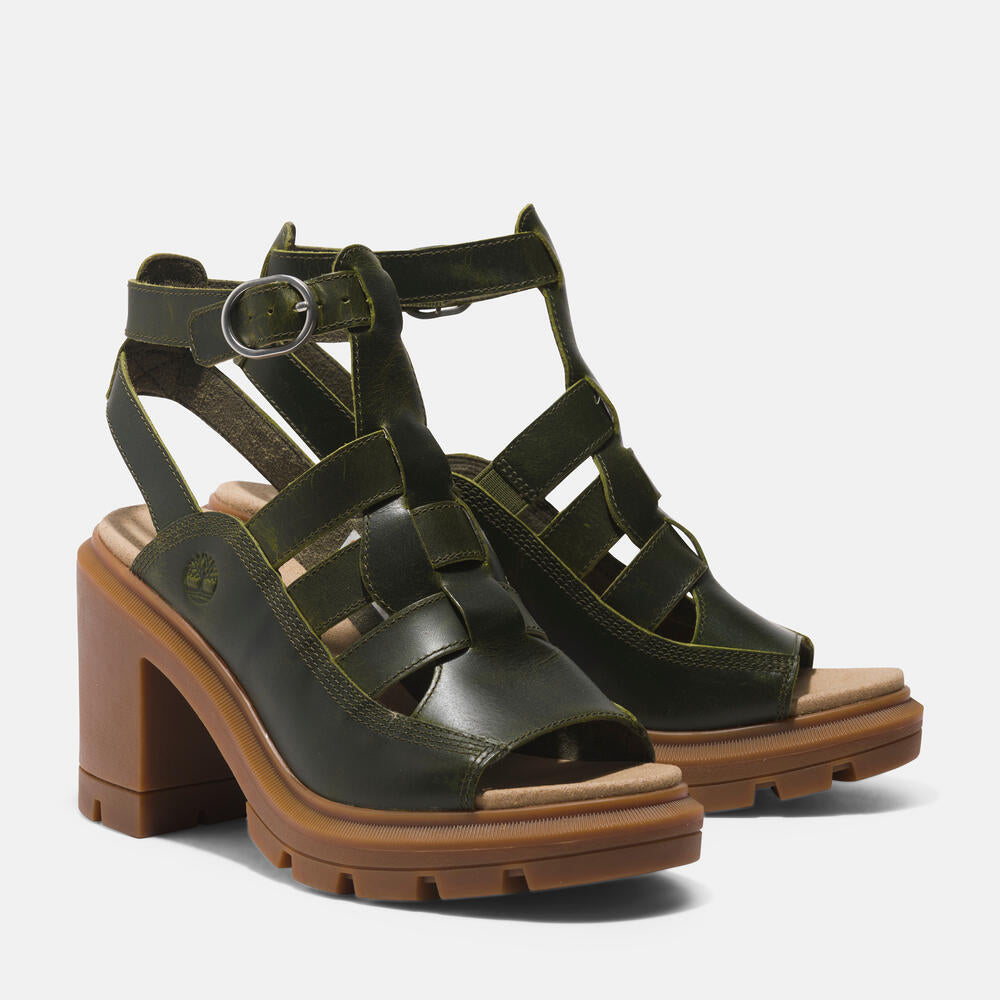 Timberland Allington Heights Fisherman Sandal for Women in Dark Green. Dark green leather sandal with adjustable buckle closure, OrthoLite footbed, and rubber outsole. Stylish and comfortable for various occasions.