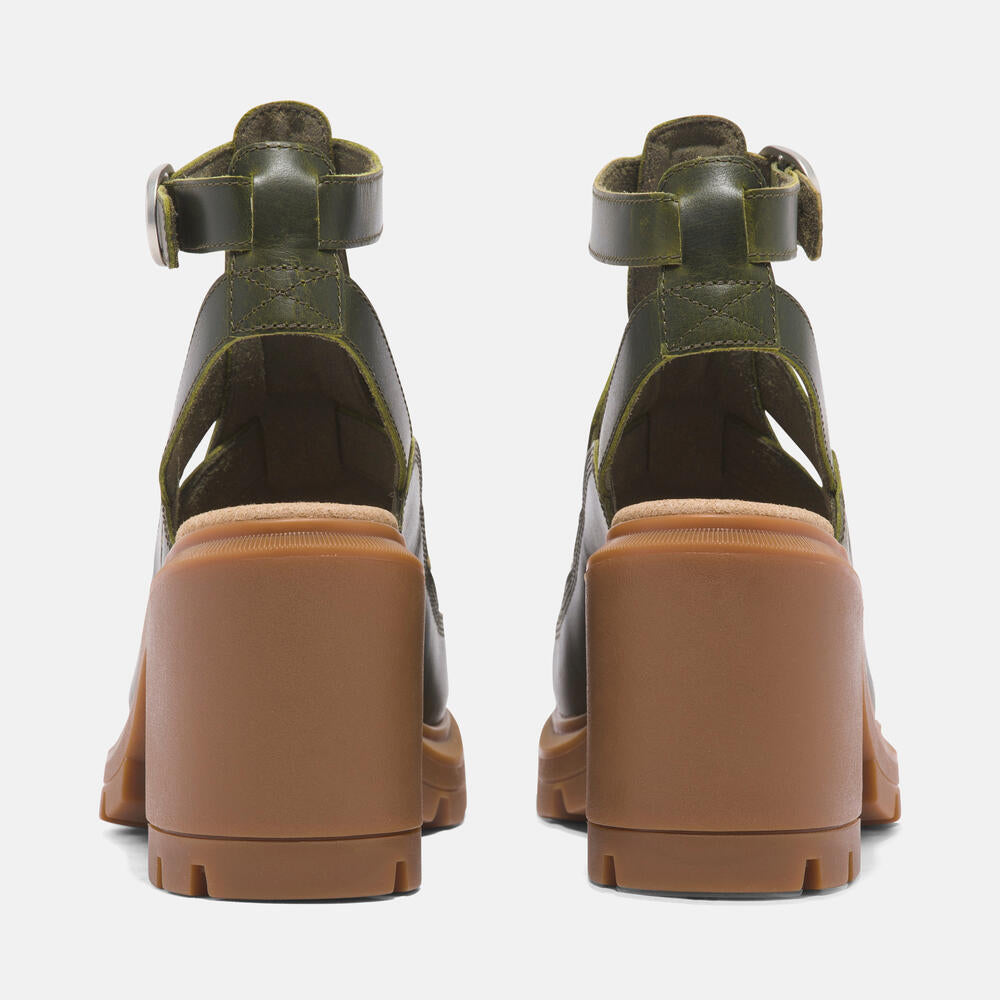 Timberland Allington Heights Fisherman Sandal for Women in Dark Green. Dark green leather sandal with adjustable buckle closure, OrthoLite footbed, and rubber outsole. Stylish and comfortable for various occasions.