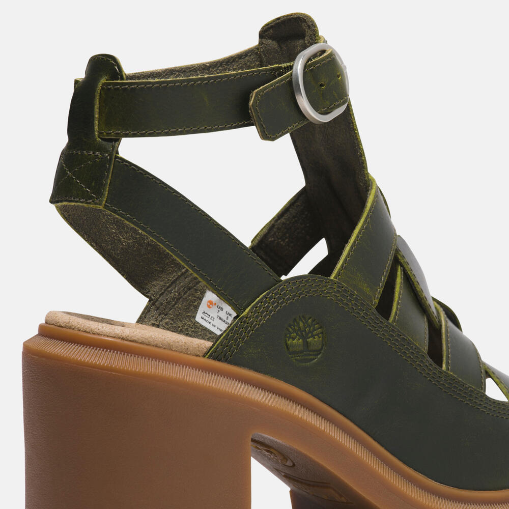 Timberland Allington Heights Fisherman Sandal for Women in Dark Green. Dark green leather sandal with adjustable buckle closure, OrthoLite footbed, and rubber outsole. Stylish and comfortable for various occasions.