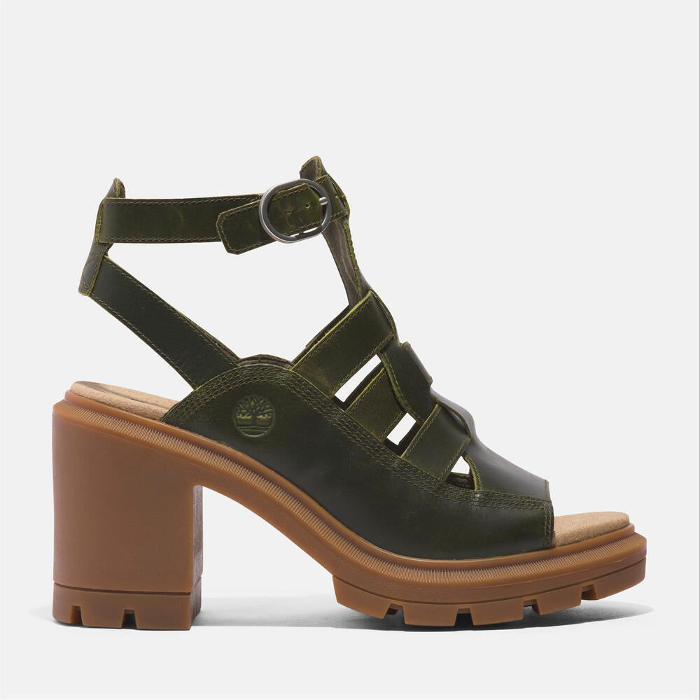 Timberland Allington Heights Fisherman Sandal for Women in Dark Green. Dark green leather sandal with adjustable buckle closure, OrthoLite footbed, and rubber outsole. Stylish and comfortable for various occasions.