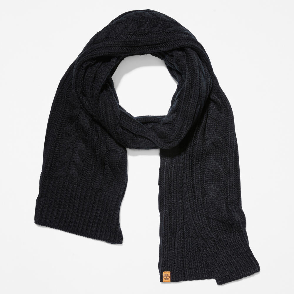 Black Timberland® Cable Knit Scarf for Women. Soft and chunky yarn blend for warmth and comfort. Cable knit design for texture and style. Classic black color for versatility.