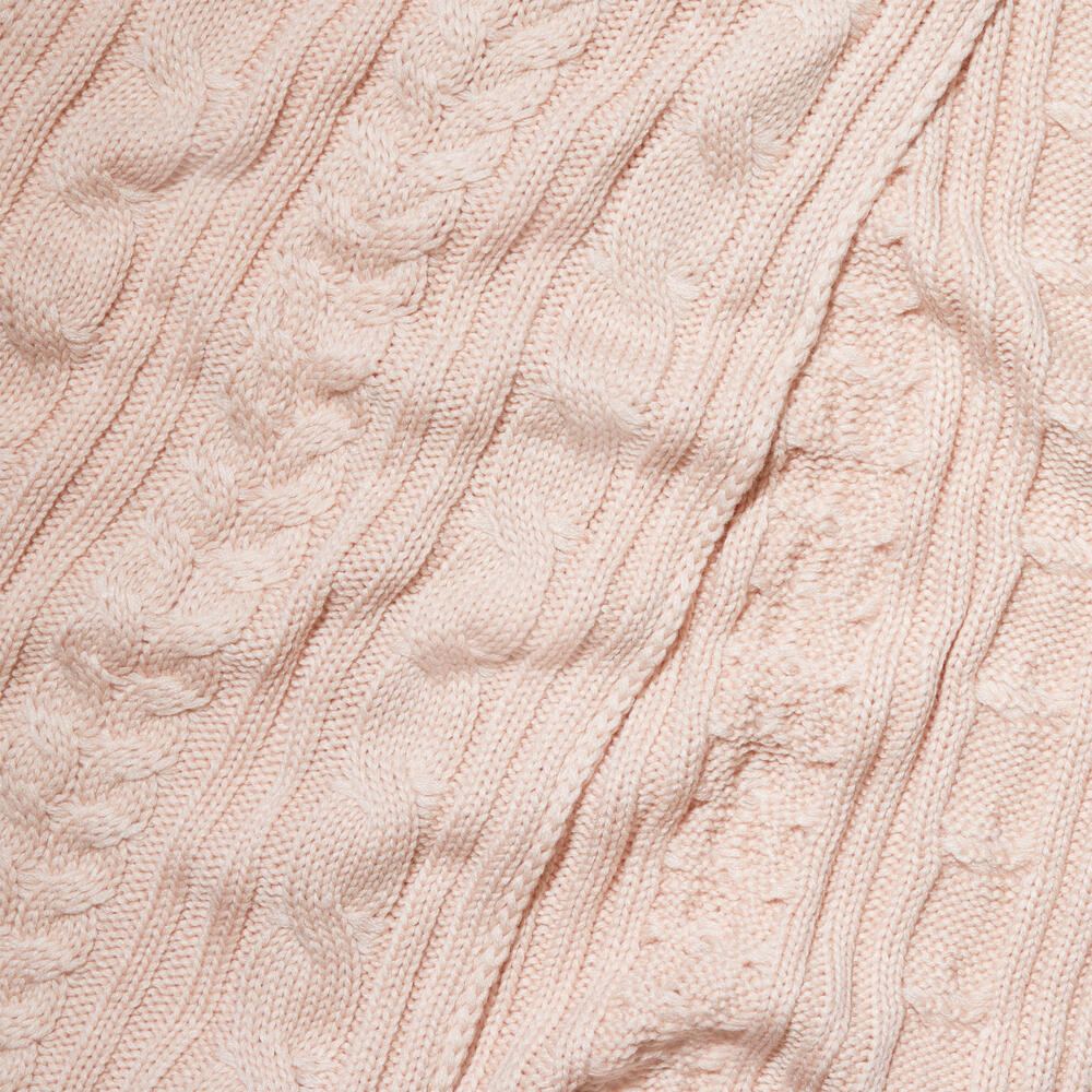 Rose Timberland Cable Knit Scarf for Women. Soft and chunky yarn blend for warmth and comfort. Cable knit design for texture and style. Delicate rose color for a feminine touch.