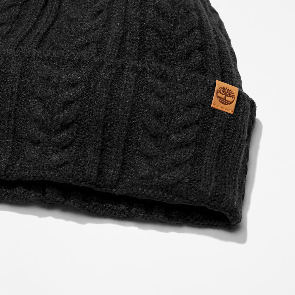 Black Timberland® Cable Knit Beanie for Women. Soft and chunky cable knit for warmth and texture. Fold-over cuff for adjustability. Black colour for versatility.