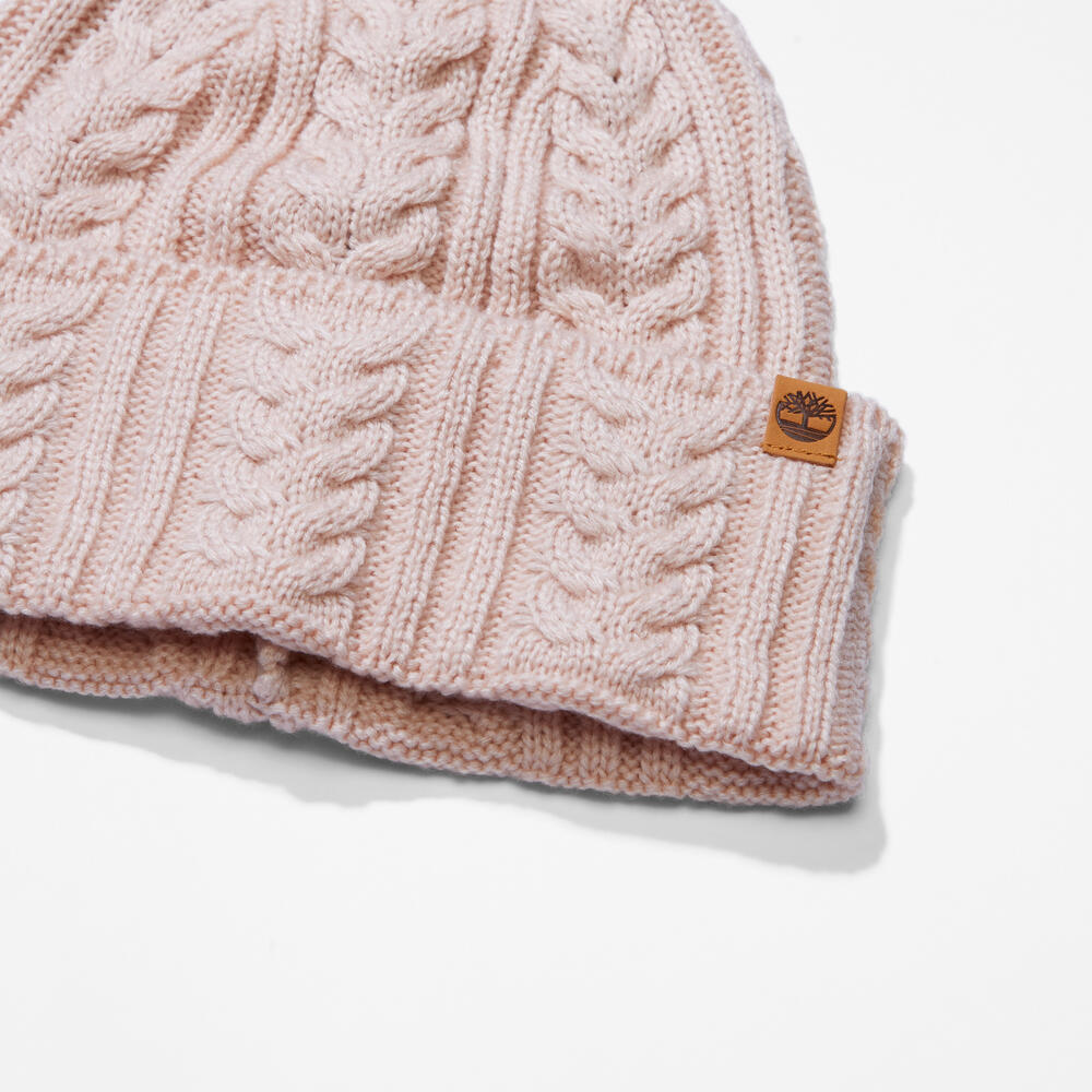 Rose Timberland® Cable Knit Beanie for Women. Soft and chunky cable knit for warmth and texture. Fold-over cuff for adjustability. Rose colour for a feminine touch.