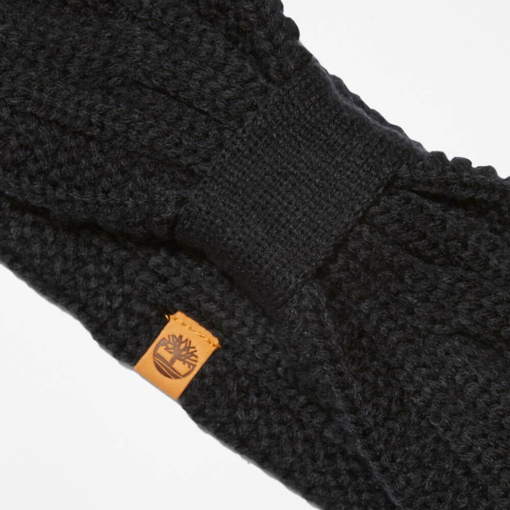 Black Timberland® Cable Knit Headband for Women. Soft and chunky cable knit for warmth and texture. Stretchy design for a comfortable fit. Black colour for versatility.