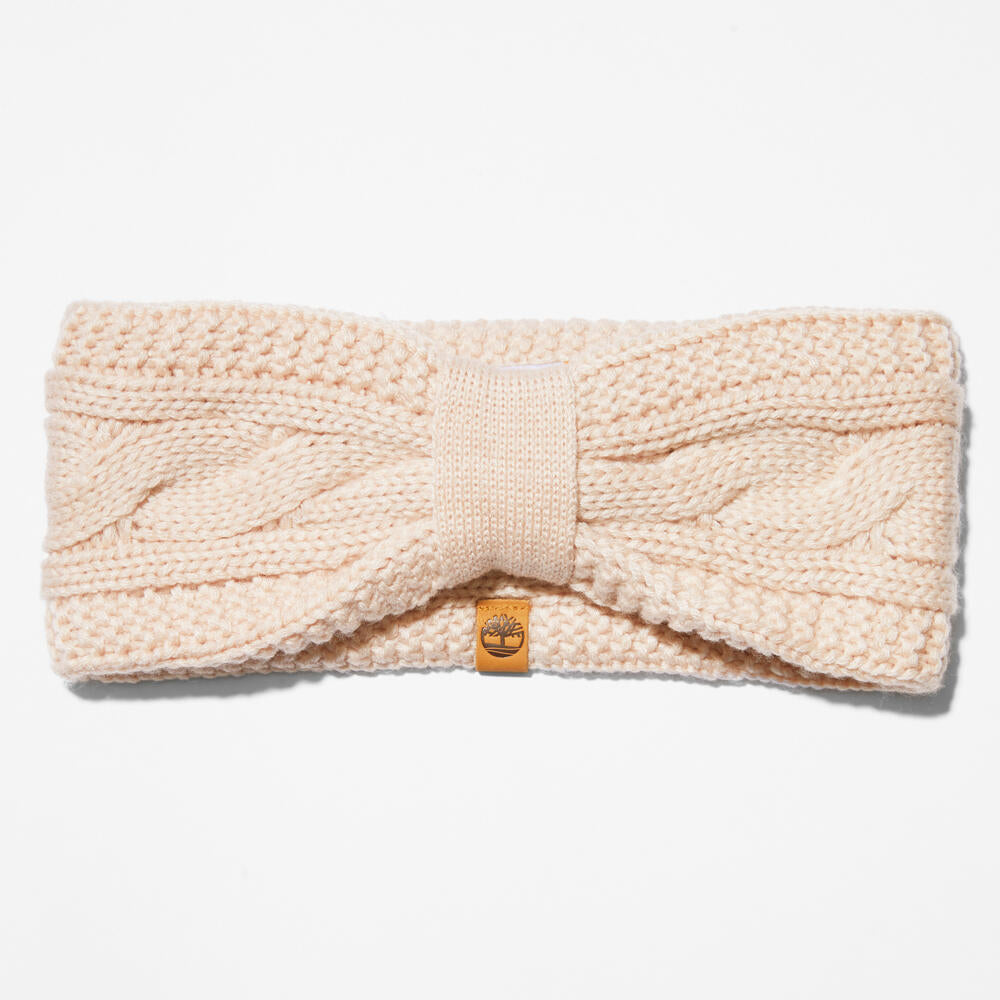 Rose Timberland® Cable Knit Headband for Women. Soft and chunky cable knit for warmth and texture. Stretchy design for a comfortable fit. Rose color for a feminine touch.