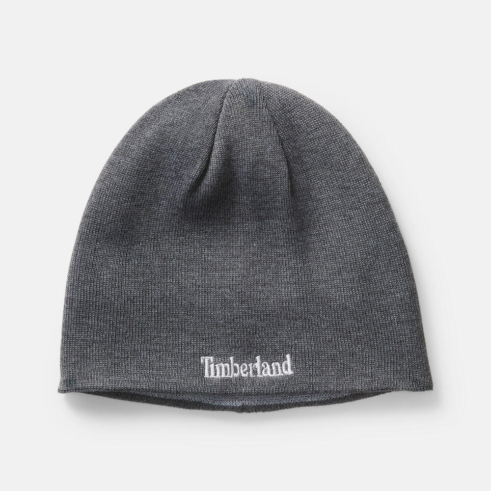 Grey TimberlandÂ® Reversible Logo Beanie for Men. Soft and chunky knit for warmth. Reversible design: solid grey or contrasting TimberlandÂ® logo. Cuffed design for adjustability. Solid grey for versatility, logo side for brand recognition.