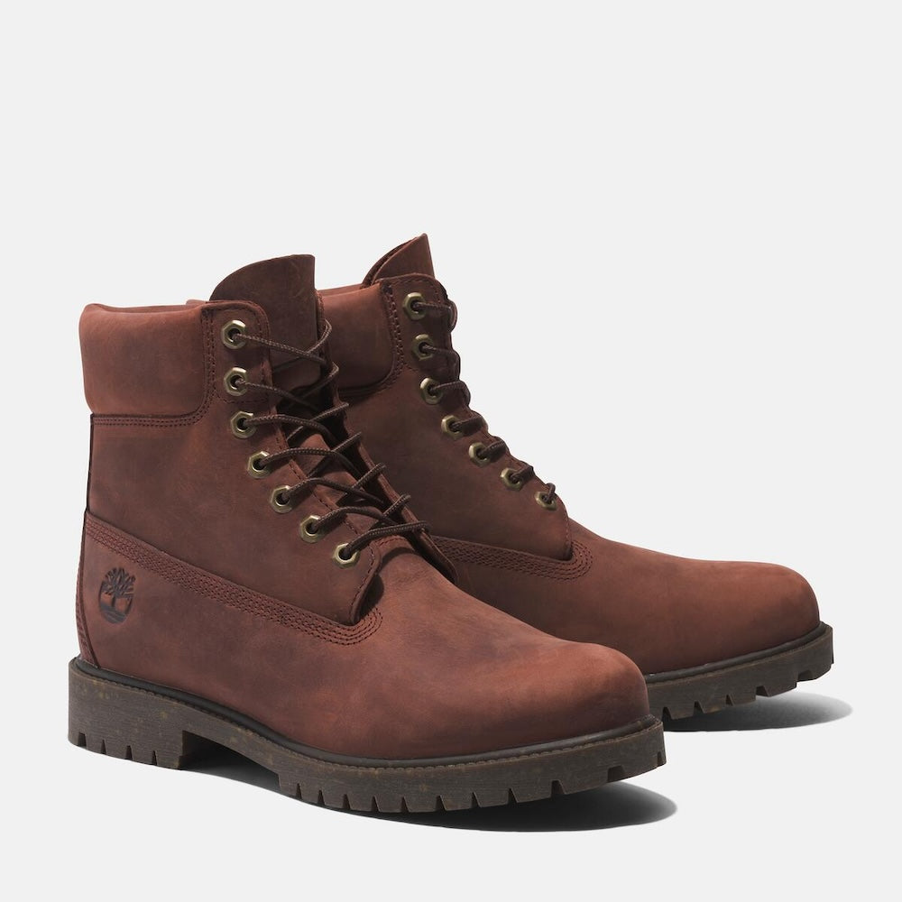 Medium brown Timberland Heritage 6-Inch Waterproof Boot for Men. Premium full-grain leather upper for durability and style. Seam-sealed construction for waterproof protection. Padded leather collar for comfort, lace-up closure for fit. Durable rubber outsole for traction