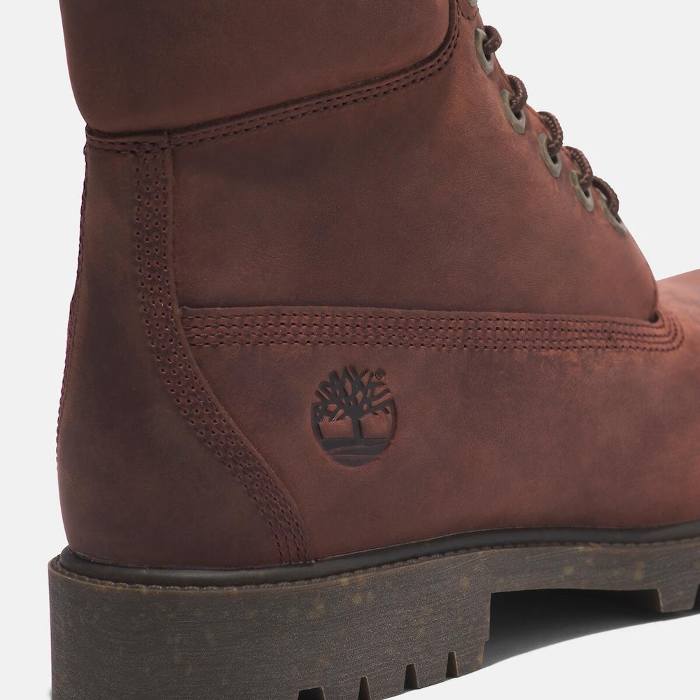 Medium brown Timberland Heritage 6-Inch Waterproof Boot for Men. Premium full-grain leather upper for durability and style. Seam-sealed construction for waterproof protection. Padded leather collar for comfort, lace-up closure for fit. Durable rubber outsole for traction