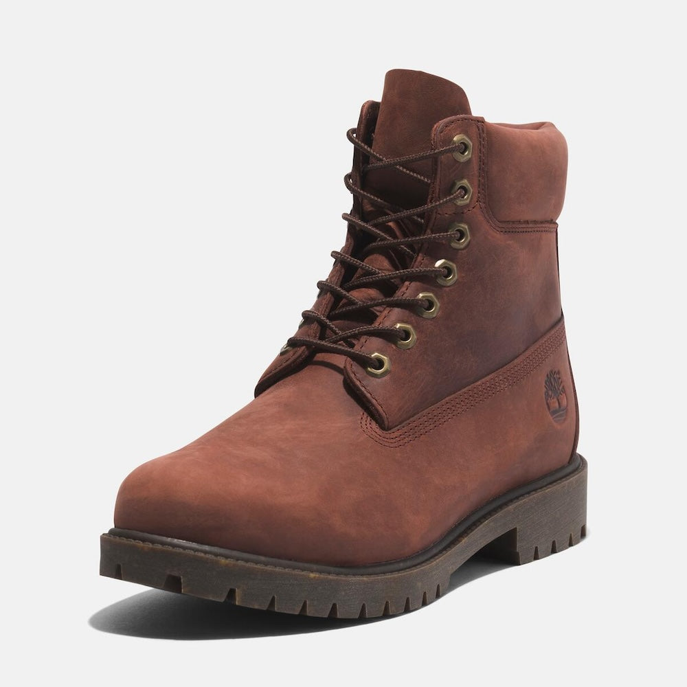 Medium brown Timberland Heritage 6-Inch Waterproof Boot for Men. Premium full-grain leather upper for durability and style. Seam-sealed construction for waterproof protection. Padded leather collar for comfort, lace-up closure for fit. Durable rubber outsole for traction