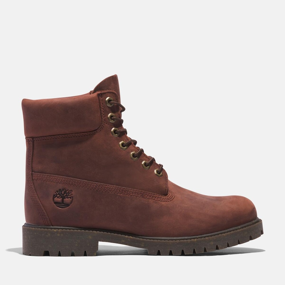 Medium brown Timberland Heritage 6-Inch Waterproof Boot for Men. Premium full-grain leather upper for durability and style. Seam-sealed construction for waterproof protection. Padded leather collar for comfort, lace-up closure for fit. Durable rubber outsole for traction
