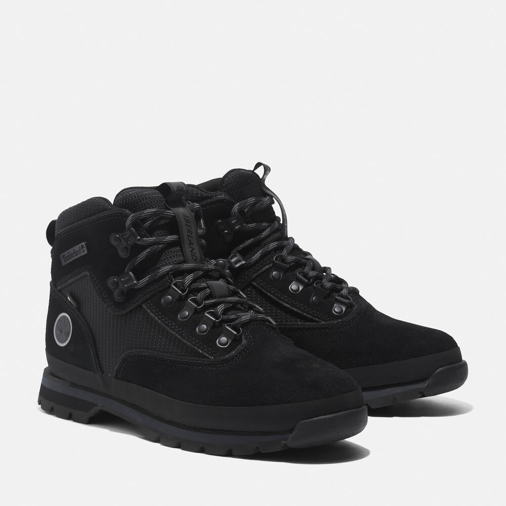 Black Timberland® Men's Euro Hiker Mid Lace-Up with Gore-Tex® Boot. Black leather and mesh upper for durability and breathability. Gore-Tex® bootie for waterproof protection. EVA footbed for cushioning. Protective rubber rand for durability. Durable rubber outsole with lugs for traction.