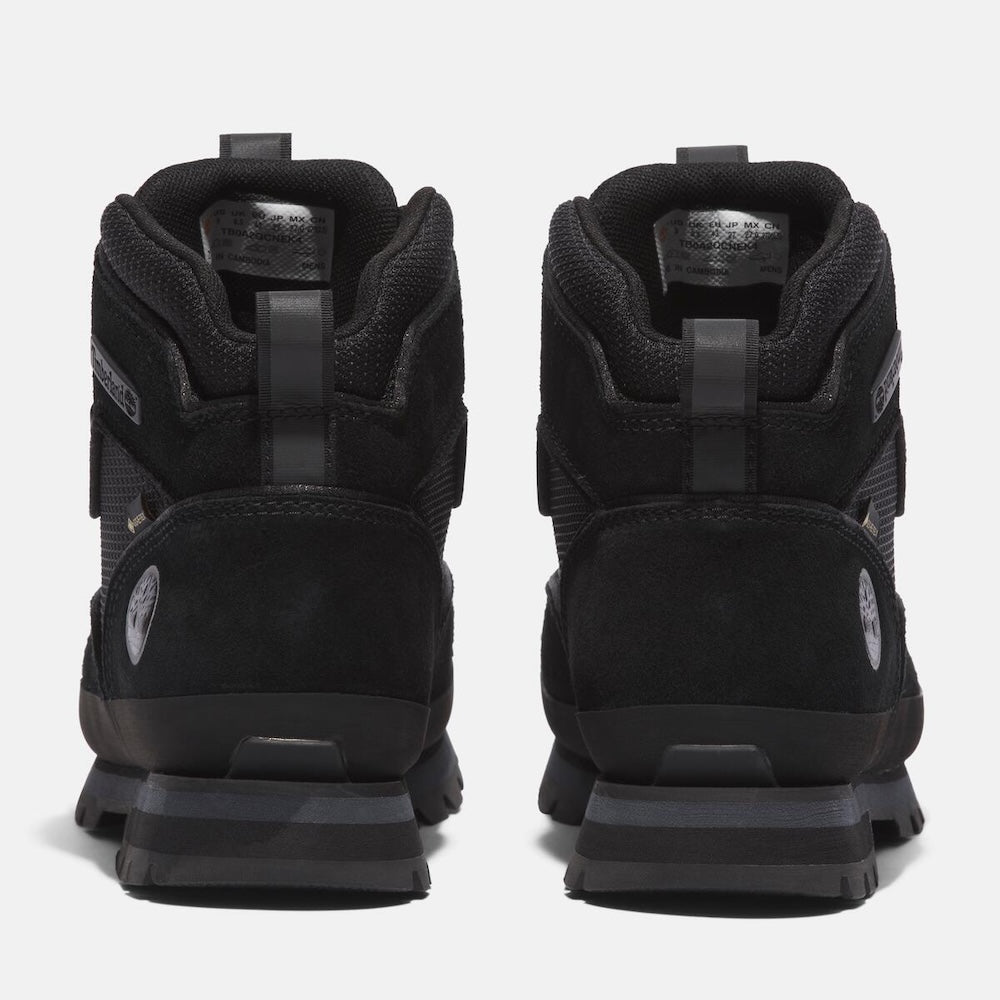 Black Timberland Men's Euro Hiker Mid Lace-Up with Gore-Tex Boot. Black leather and mesh upper for durability and breathability. Gore-Tex bootie for waterproof protection. EVA footbed for cushioning. Protective rubber rand for durability. Durable rubber outsole with lugs for traction.