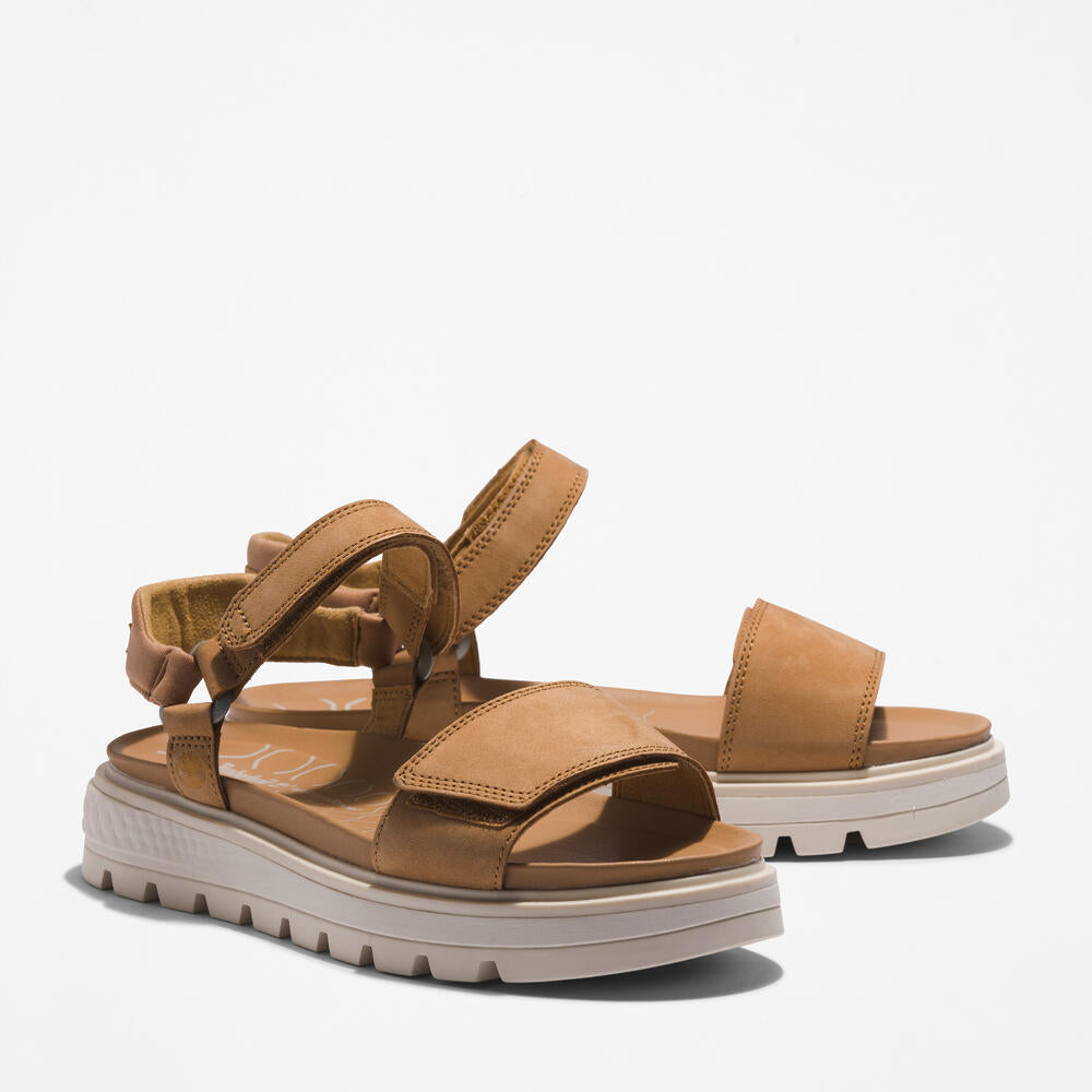 Timberland® Ray City Ankle Strap Sandal for Women in Wheat. Wheat leather sandal with ankle strap, comfortable cushioning, and durable outsole. Versatile for casual wear and urban adventures.