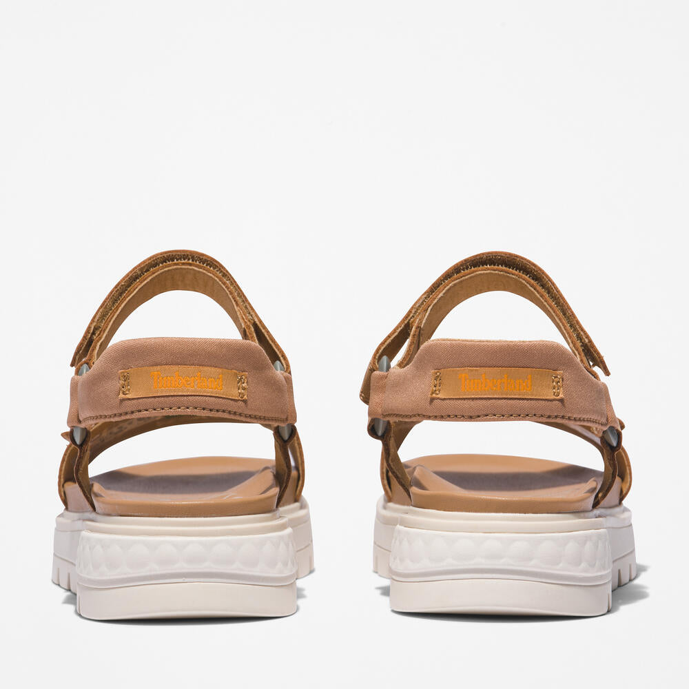 Timberland® Ray City Ankle Strap Sandal for Women in Wheat. Wheat leather sandal with ankle strap, comfortable cushioning, and durable outsole. Versatile for casual wear and urban adventures.