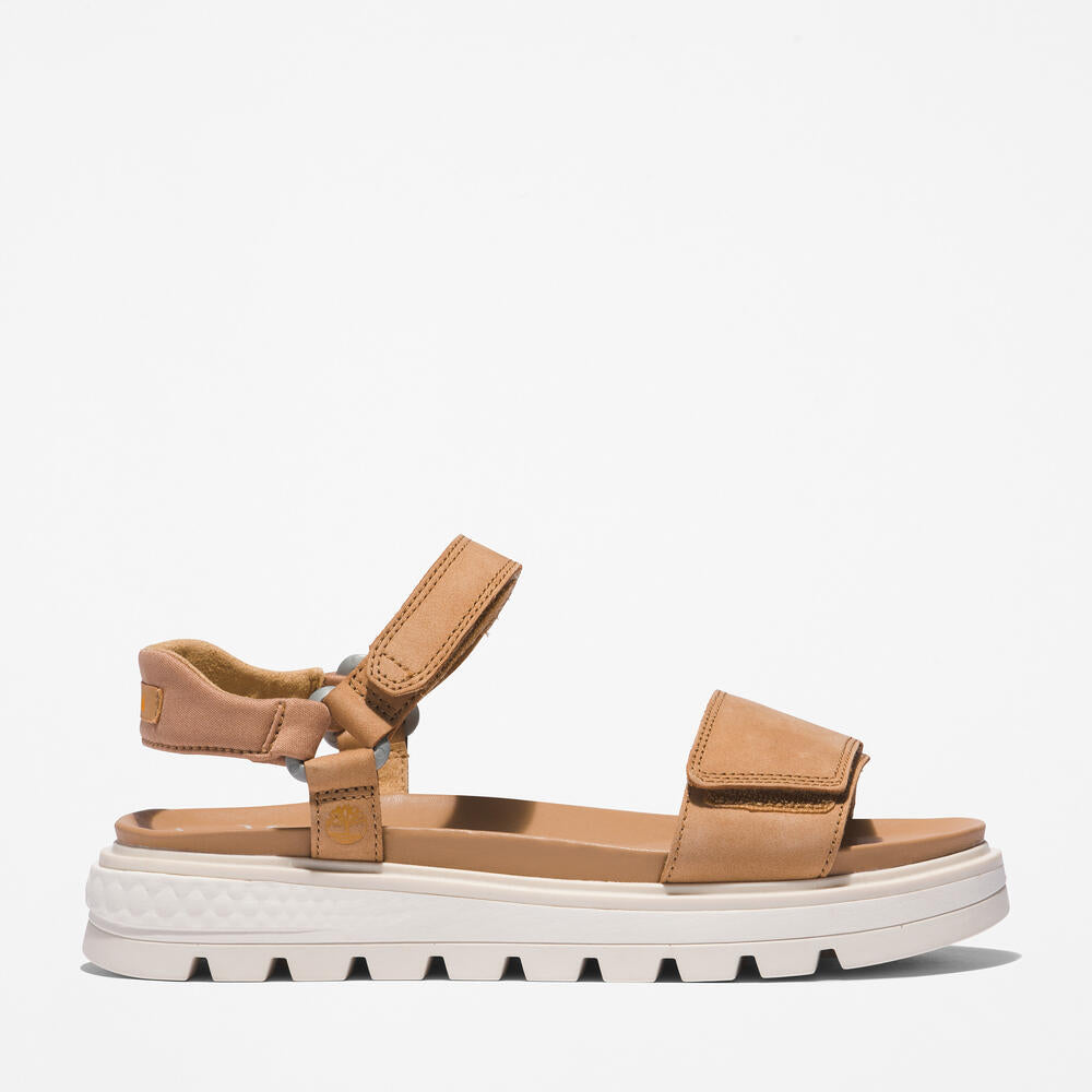 Timberland® Ray City Ankle Strap Sandal for Women in Wheat. Wheat leather sandal with ankle strap, comfortable cushioning, and durable outsole. Versatile for casual wear and urban adventures.