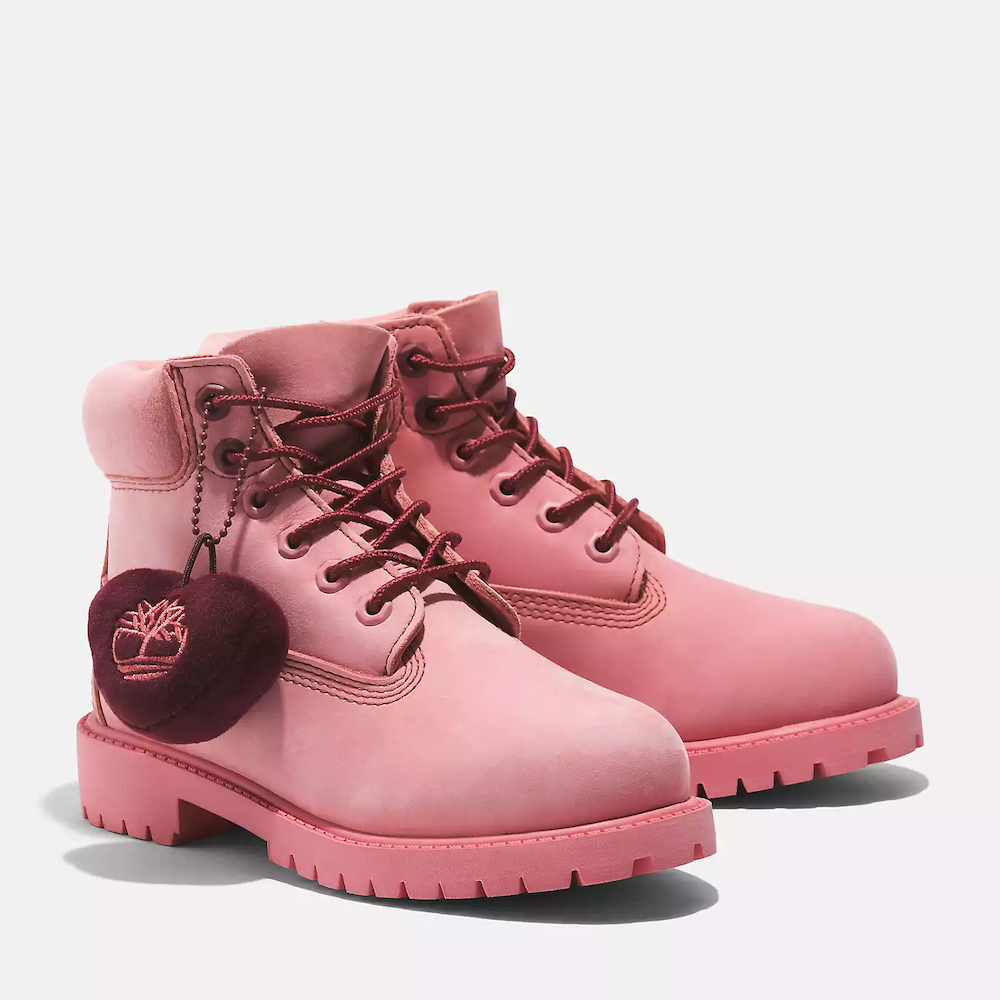 Pink Timberland® Premium 6-Inch Waterproof Boot for Junior. Pink nubuck leather boot for kids. Waterproof construction for wet weather. Padded collar for comfort, lace-up closure for secure fit. Durable outsole for traction.